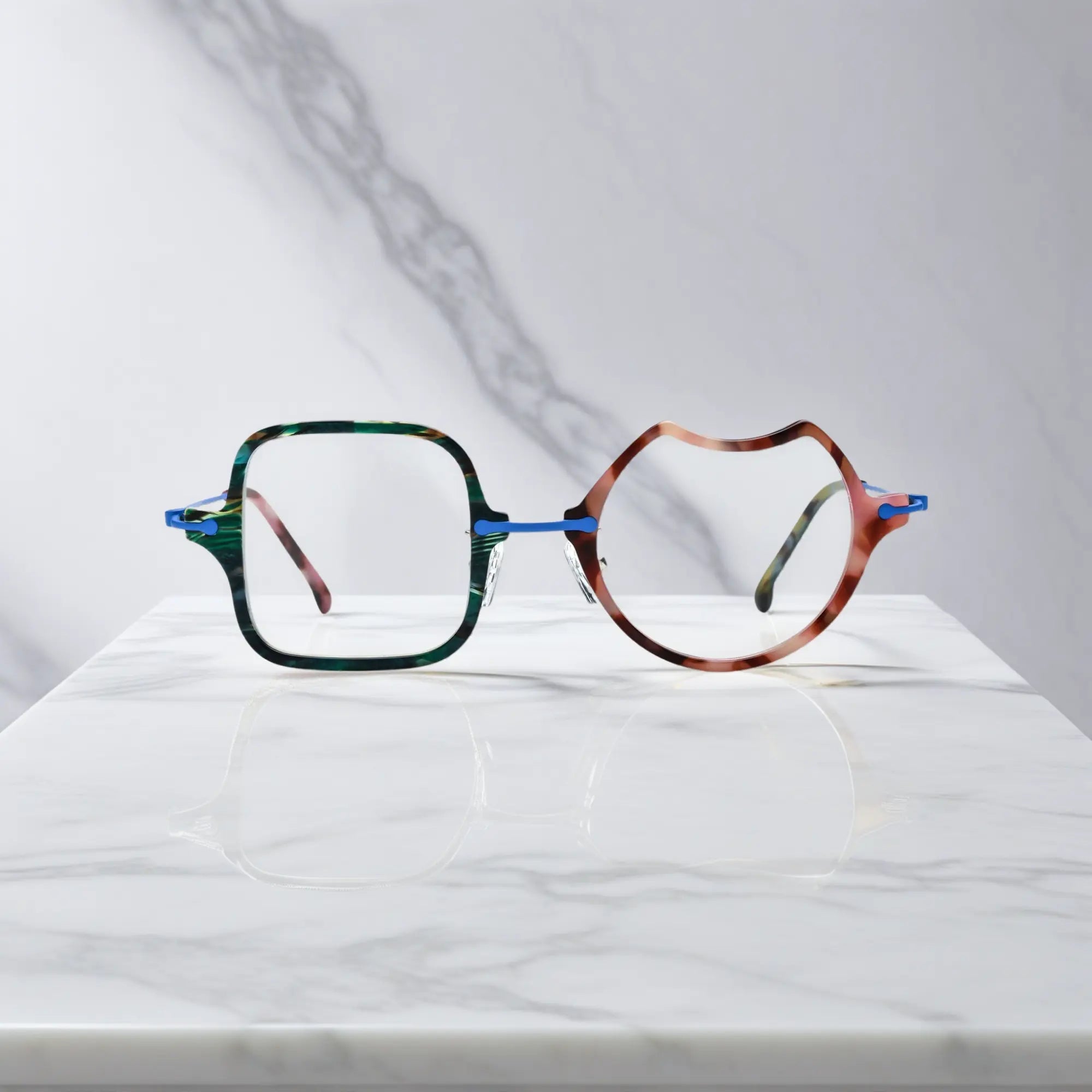 Front View of VoyueLens™ Ocean Brick abstract eyeglasses VL185842. Close-up of the front-facing design showing the asymmetric lens combination with acetate finish.